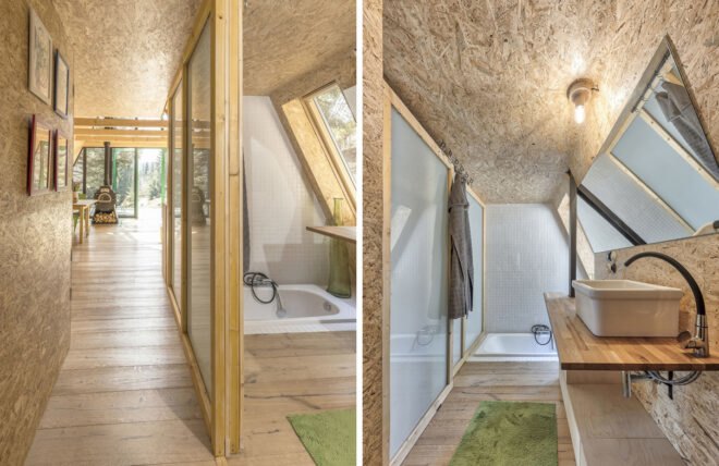 wood-lined bathroom with white tiles and green rug