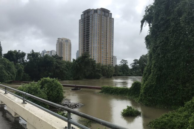 flooded river with building in distance