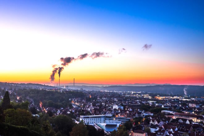 smog fills a city at sunset