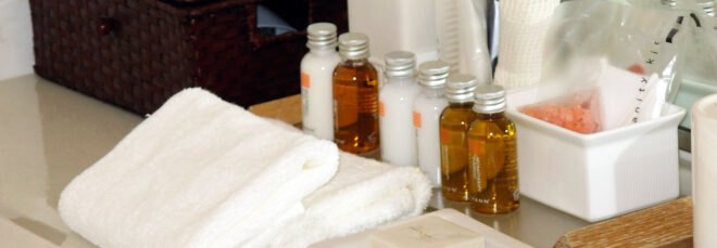 mini hotel toiletries on a sink