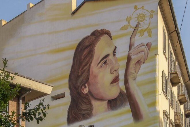 painting of a girl on a yellow wall