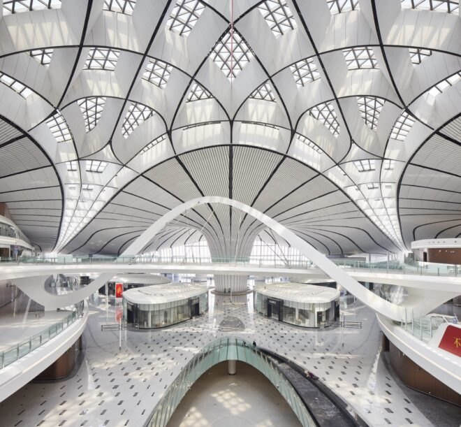 white airport with curving lines on the ceiling