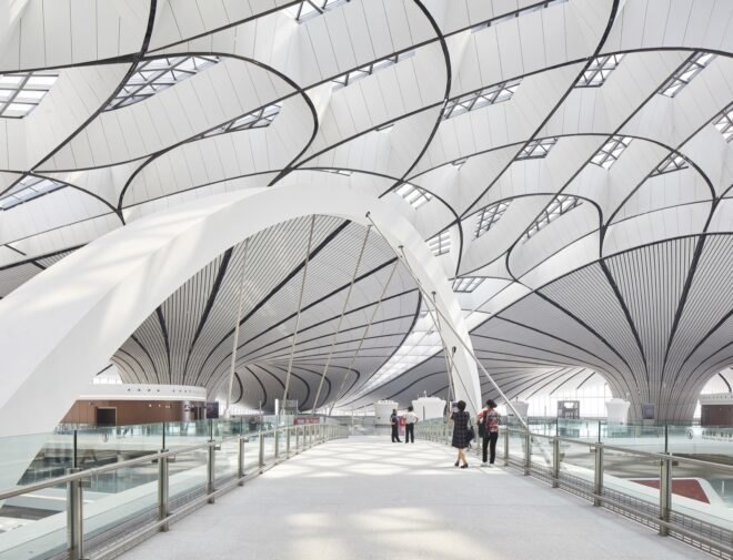 white airport with curving lines on the ceiling