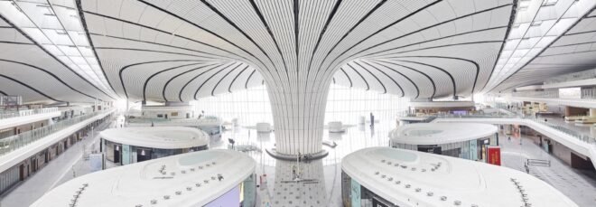 white airport with curving lines on the ceiling