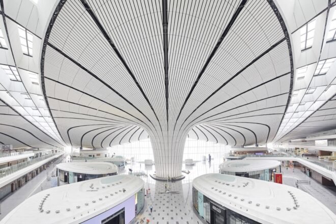 white airport with curving lines on the ceiling