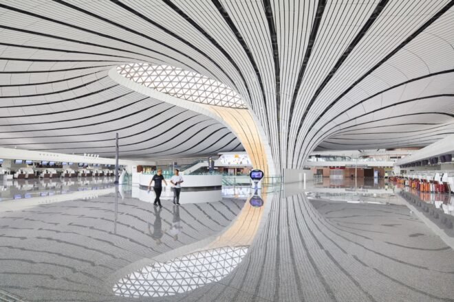 white airport with curving lines on the ceiling