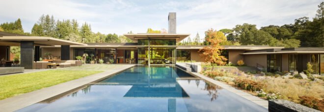 large pool leading up to home