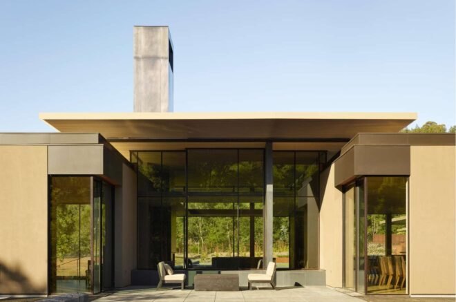 entrance to large home with glazed facades
