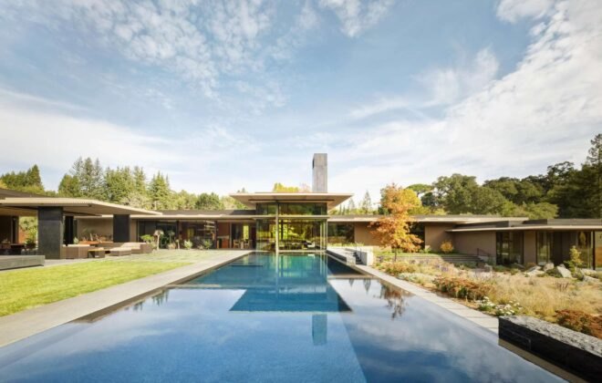 large pool leading up to home