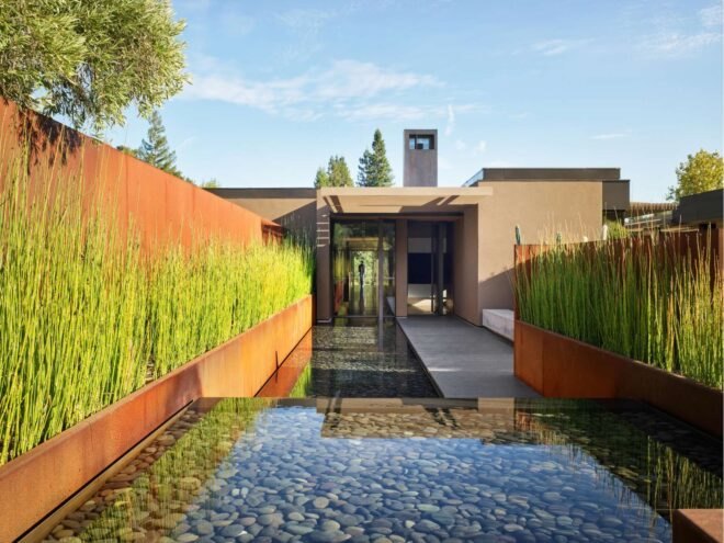 large pool leading up to home