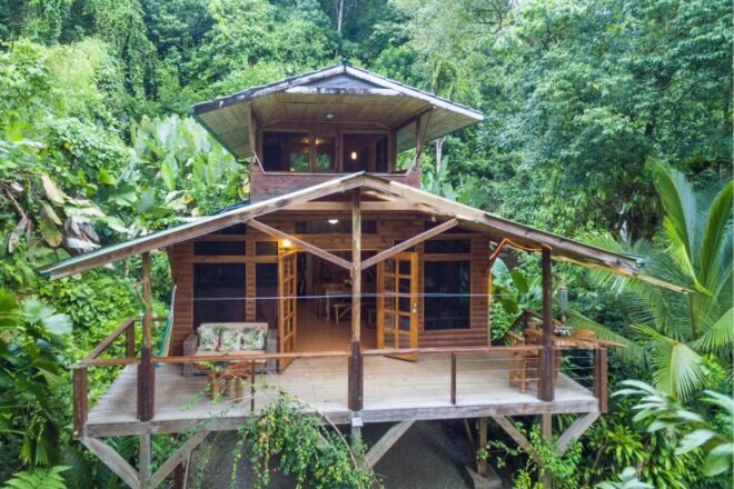 two-story treehouse with large deck