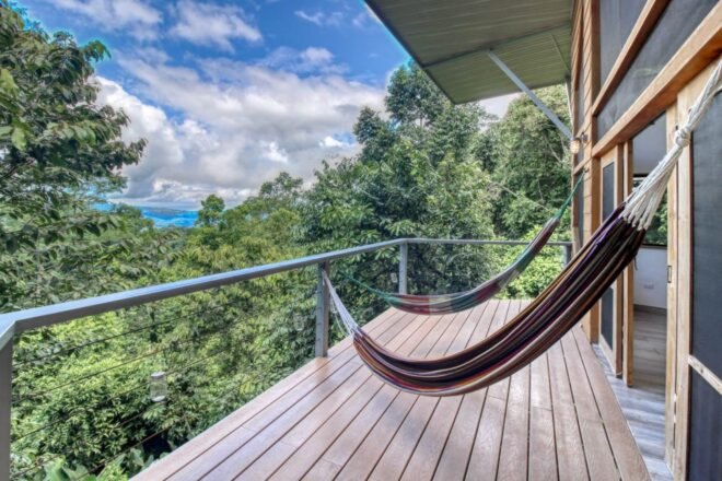 open-air deck with hanging hammocks