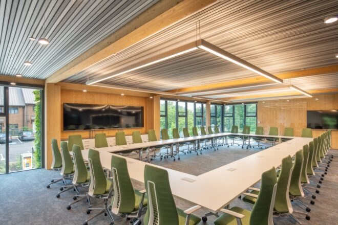 green chairs around white rectangular table