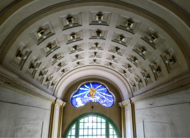 arched entranceway with stained glass window