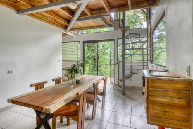 large dining area with long table and six chairs