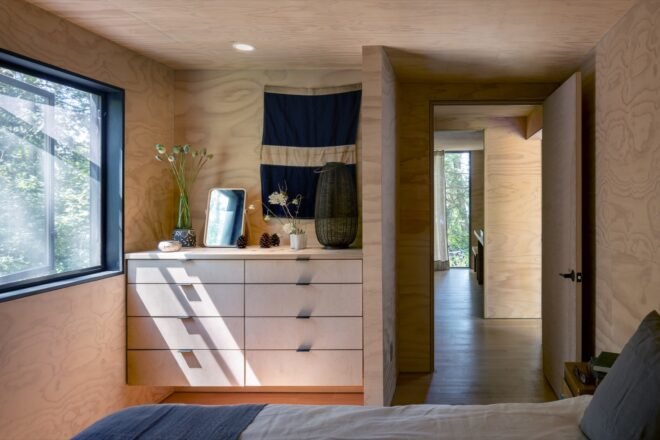 interior of home with wooden floors and white dresser near wall