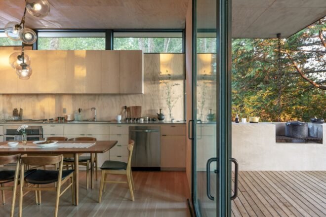 glass door and glass window in dining area with wood floors and high windows