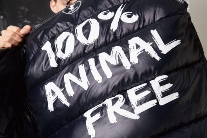 black jacket that says 100% animals free on back