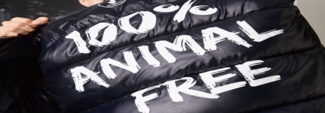 black jacket that says 100% animals free on back