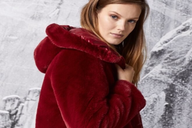 woman wearing red velvet coat