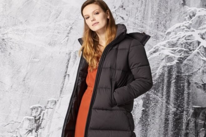 woman wearing long black jacket