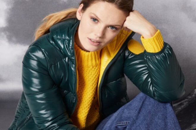 woman wearing green jacket with yellow lining
