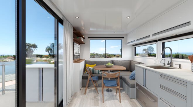 rv living room with gray couch and white kitchen