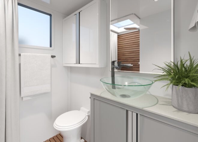 white bathroom with glass bowl sink in an rv