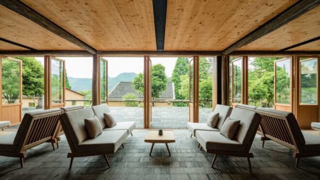 interior of retreat in living space with floor to ceiling windows