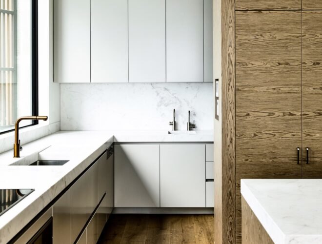interior of home with wooden floors and walls with white countertops
