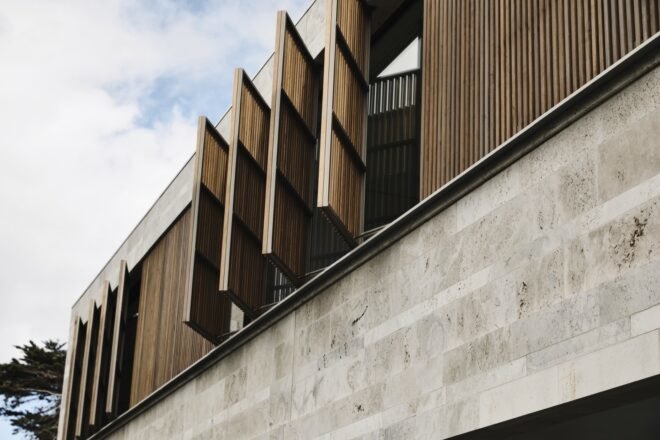 exterior view of the home with wooden panels opened