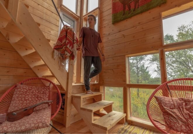 person walking down wood steps