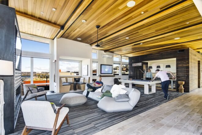 lounge with wood ceilings and gray chairs
