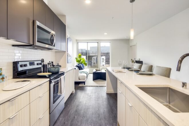 kitchen with light wood cabinets and dark wood floors