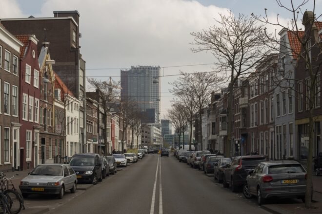 current photo of street between old buildings