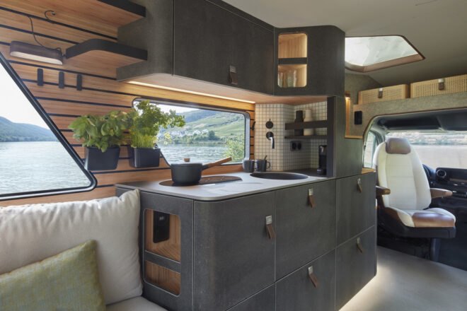 rendering of black kitchen inside a camper van