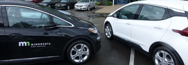 black and white electric cars in a parking lot