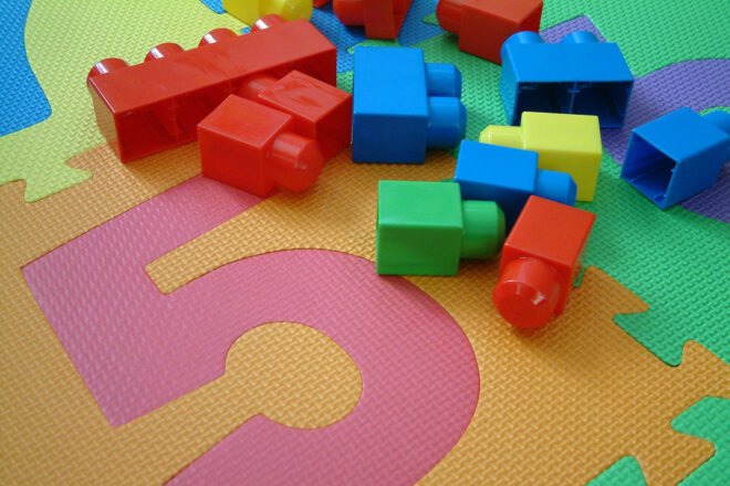 plastic block toys on a plastic mat