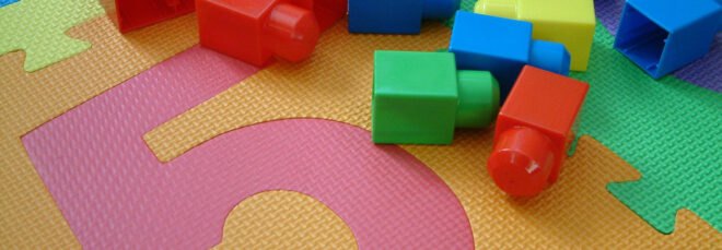plastic block toys on a plastic mat