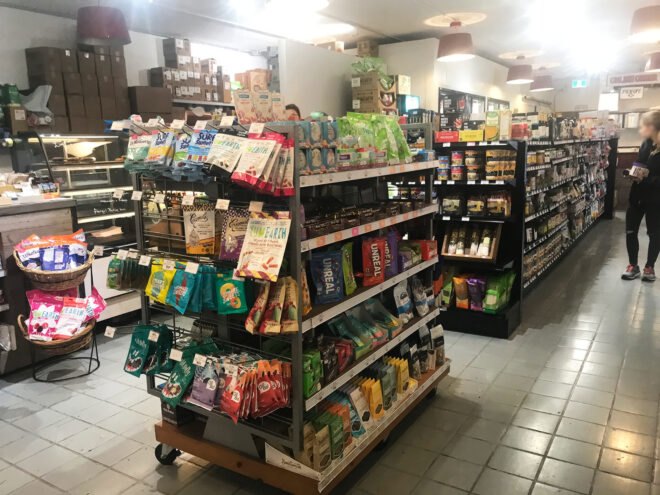 grocery store with shelves of vegan snacks
