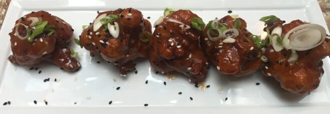 sweet-chili cauliflower on white plate