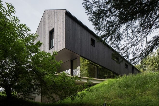 dark home with glass first floor