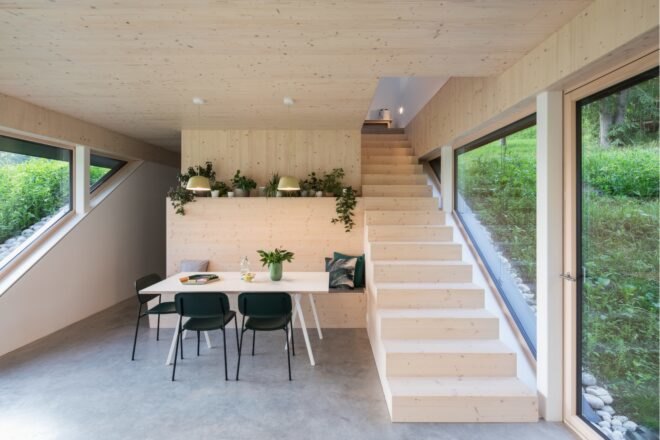 living area with dining table and stairs