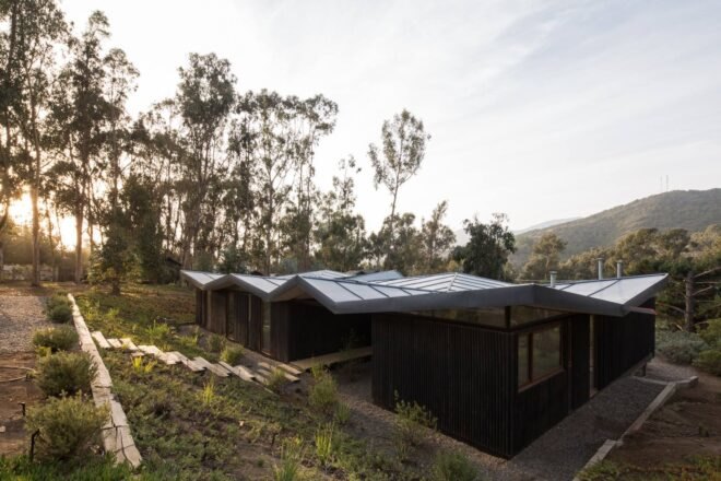 low-rise home with zigzag metal roof