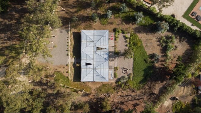 aerial view of home with metal roof