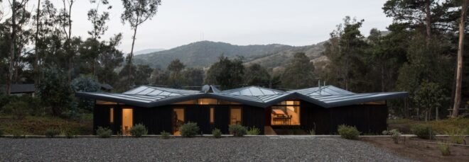 low-rise home with zigzag metal roof