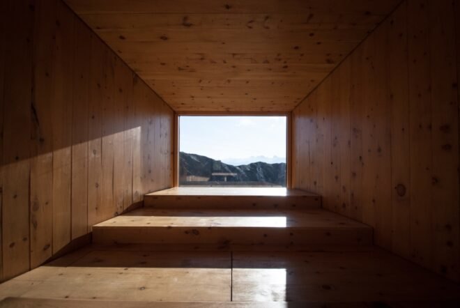interior of wooden shelter with large window