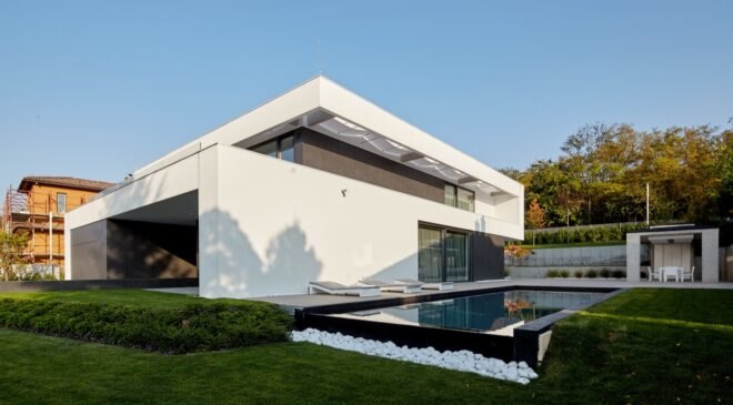 black and white home with pool