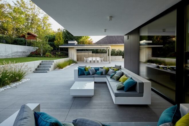 outdoor deck with white and gray sofa