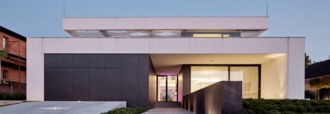 black and white home with long walkway